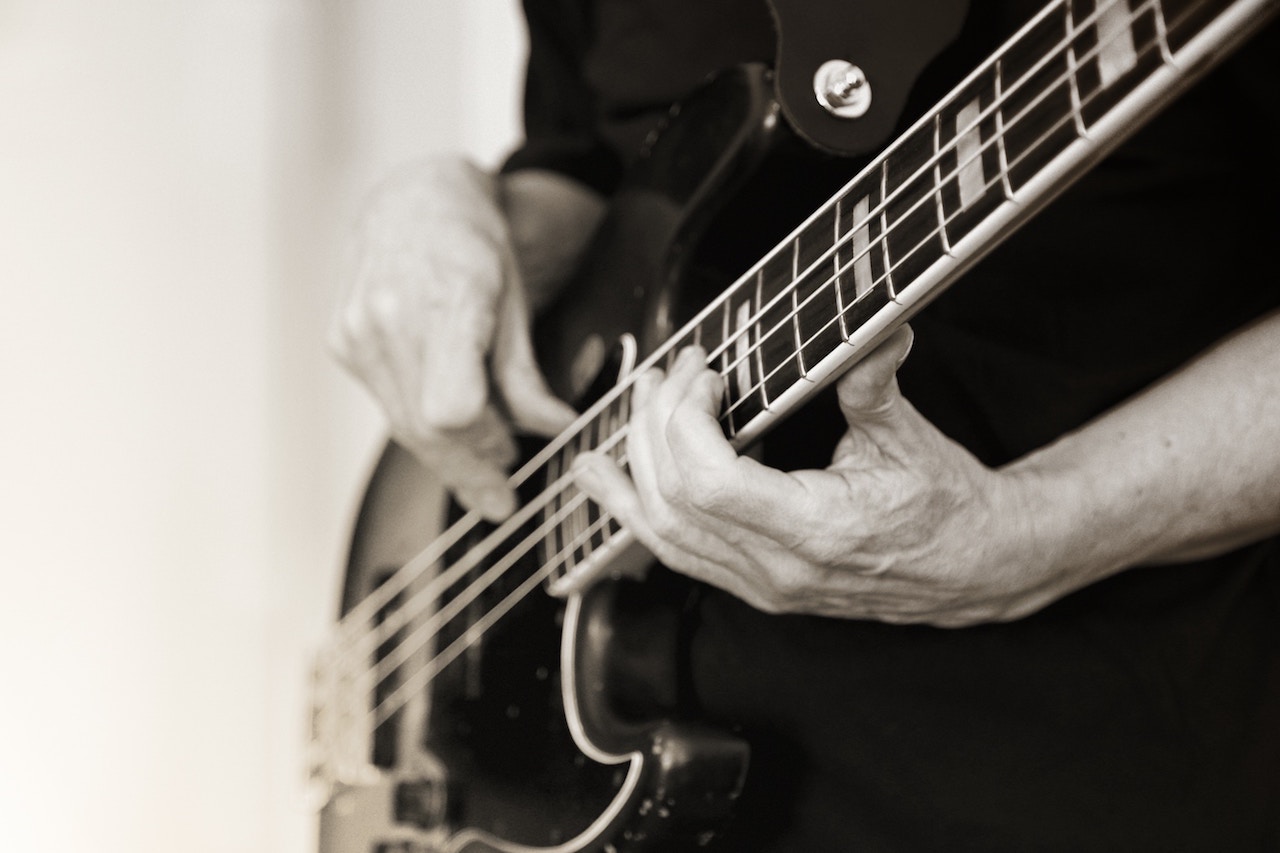 A man playing electric bass